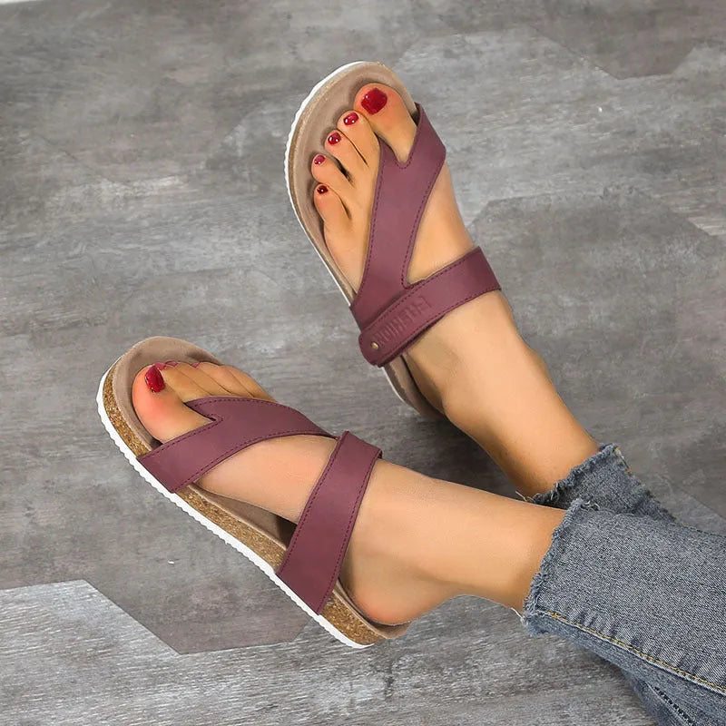 Flat toe ring thick-soled flip-flops in blue, showing artificial PU upper and foam sole.