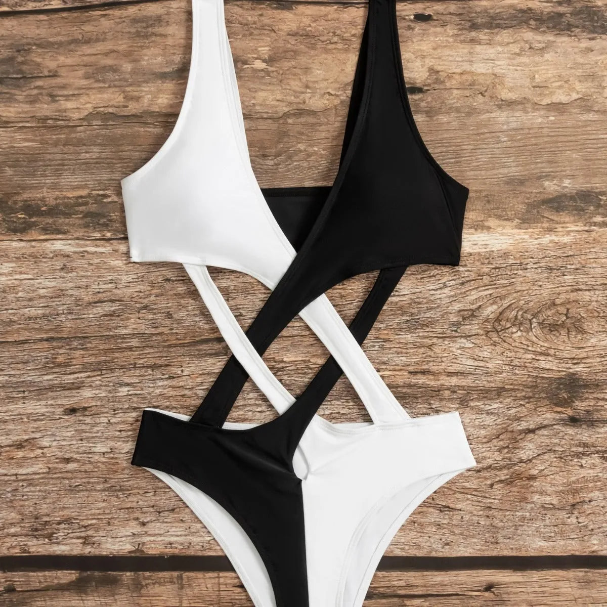 White women's one-piece swimsuit with hollow out colour blocking design.