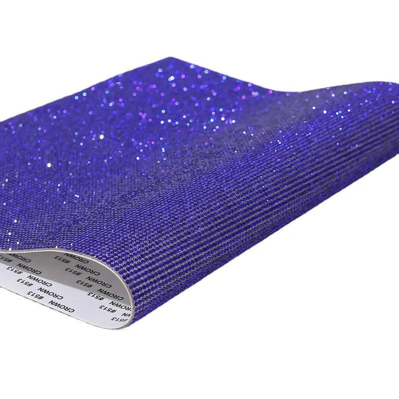 Sheet of rhinestones on adhesive net with hot drill glue backing in assorted colours.