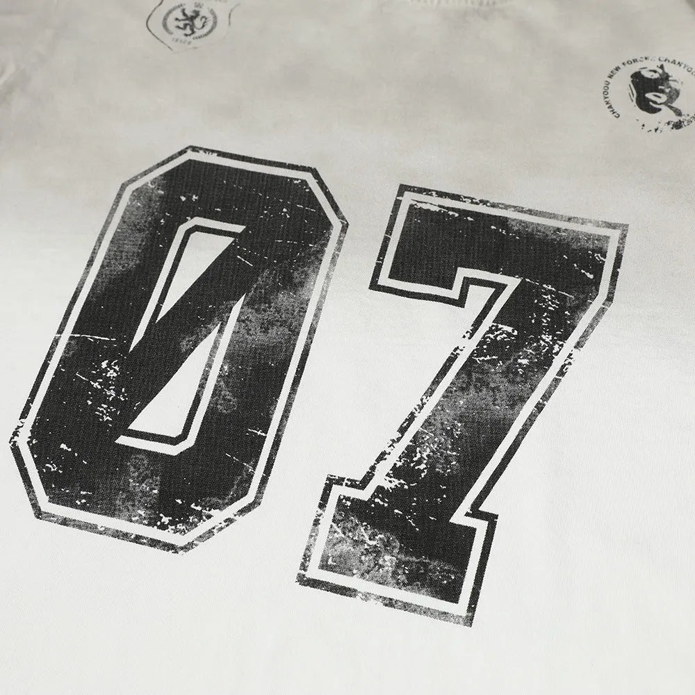 Men's black and white pure cotton short-sleeved T-shirt laid flat.