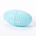 Blue silicone rugby ball dog chew toy with multiple small food leak holes on a white background.