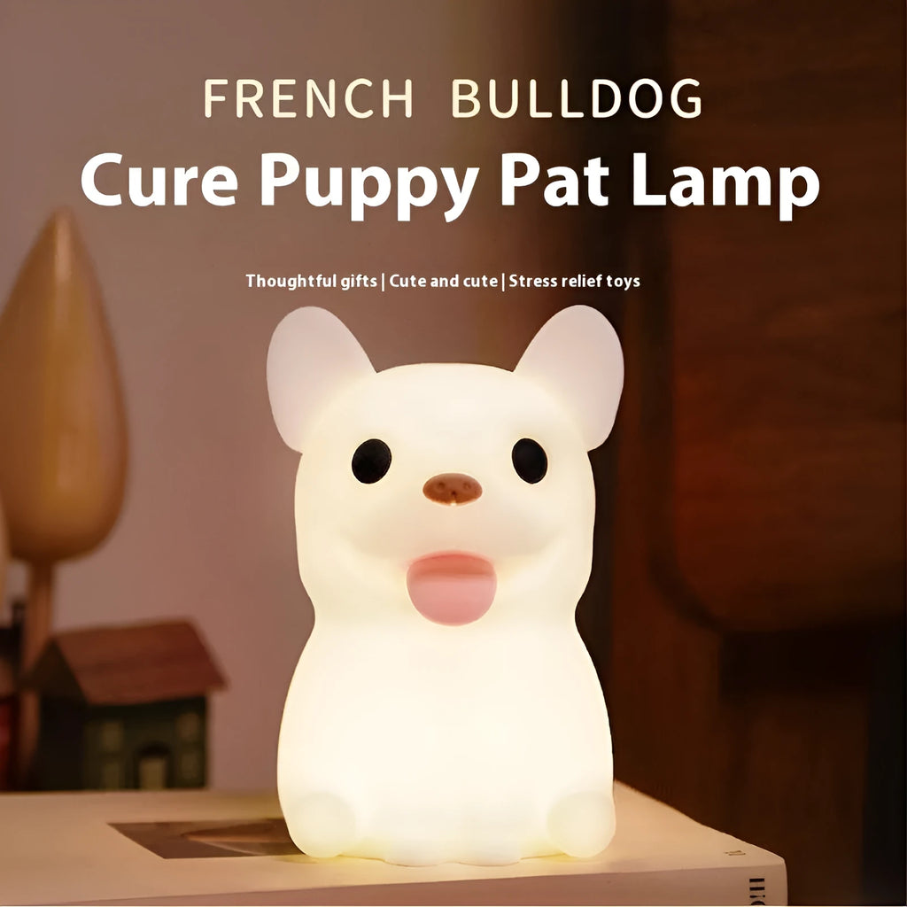 Cartoon animal silicone USB night light with dimmer switch on a bedside table.