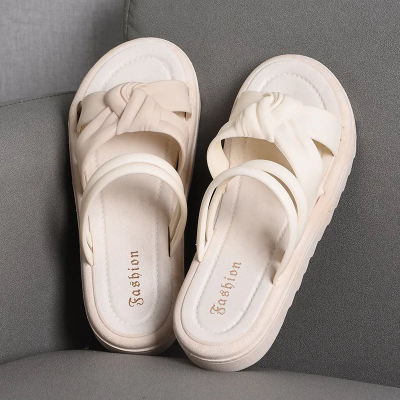 Women's black outdoor sandals with thick soft back and flower detailing on PVC upper