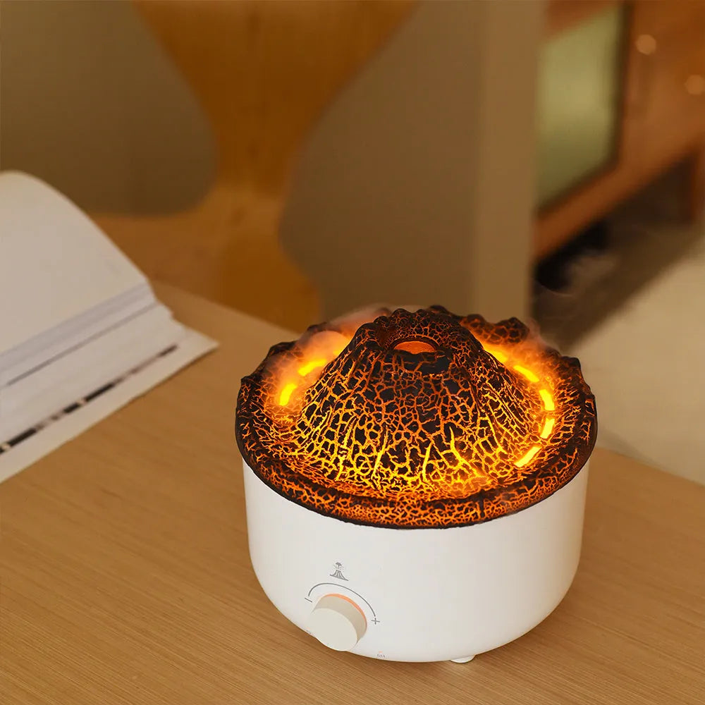 White simulated flame volcano humidifier diffuser with remote control on tabletop