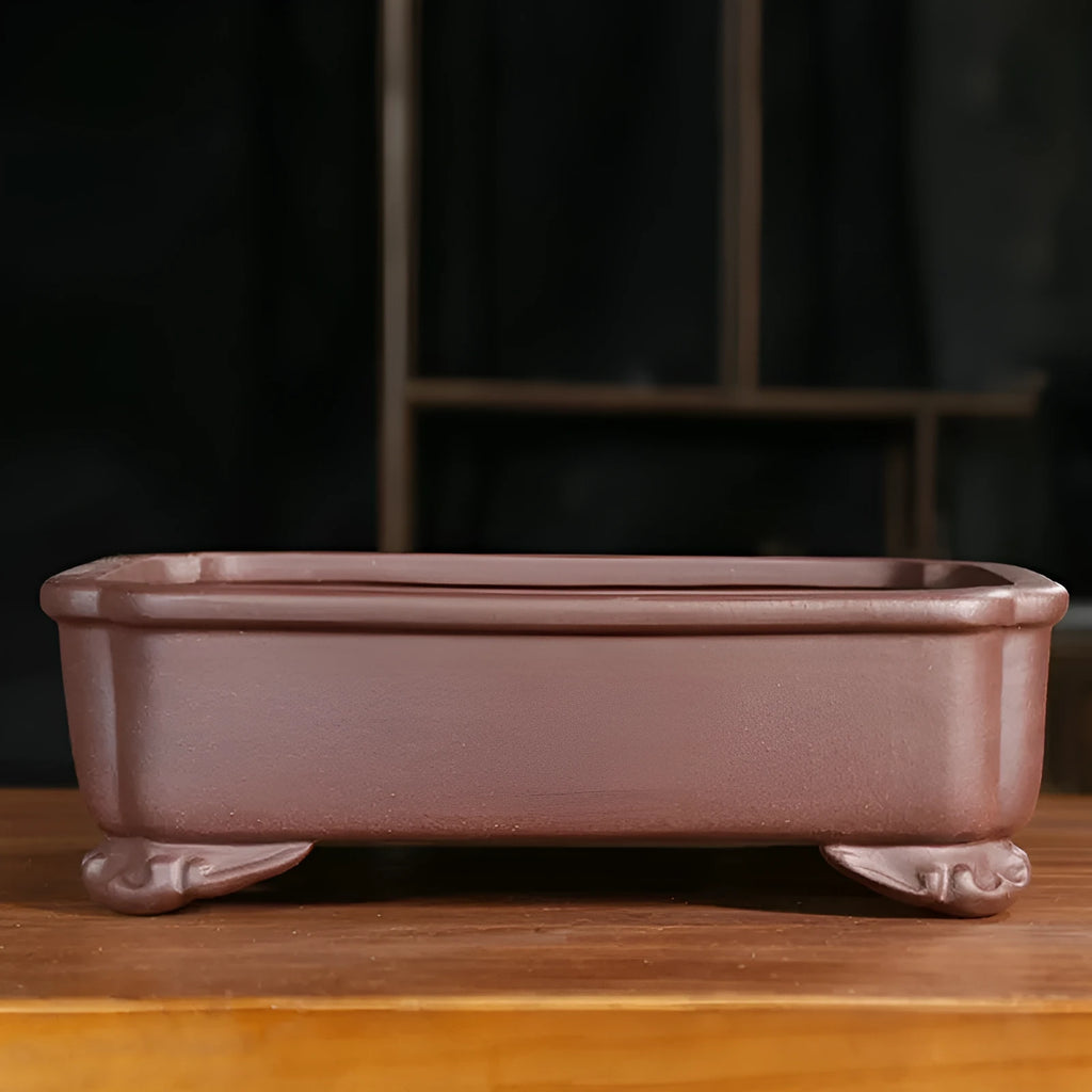 Antique rectangular purple sand clay bonsai pot on a floor, shown in two size options.