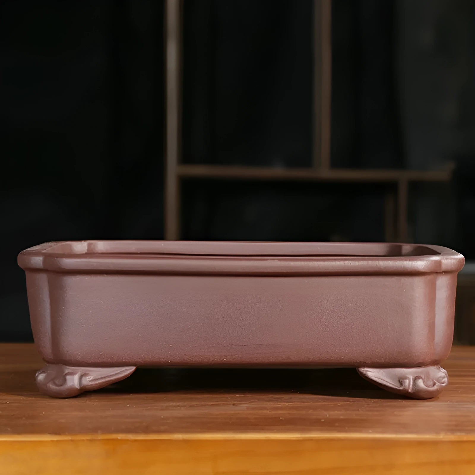 Antique rectangular purple sand clay bonsai pot on a floor, shown in two size options.