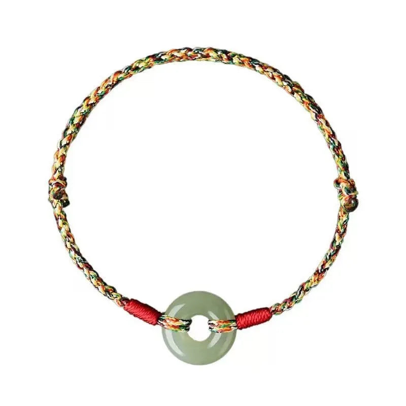 Colourful woven rope bracelet with peace buckle closure on wrist