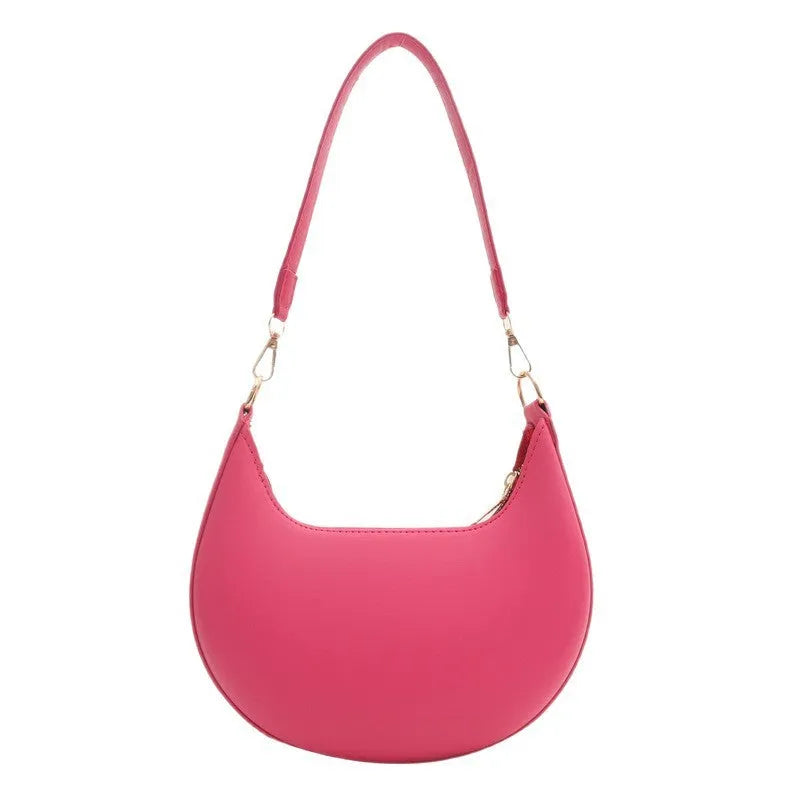 21cm round PU underarm bag with single shoulder strap in seven colour options showing mobile phone pocket