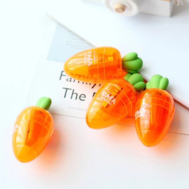 Orange plastic carrot cartoon pencil sharpener on a white background.