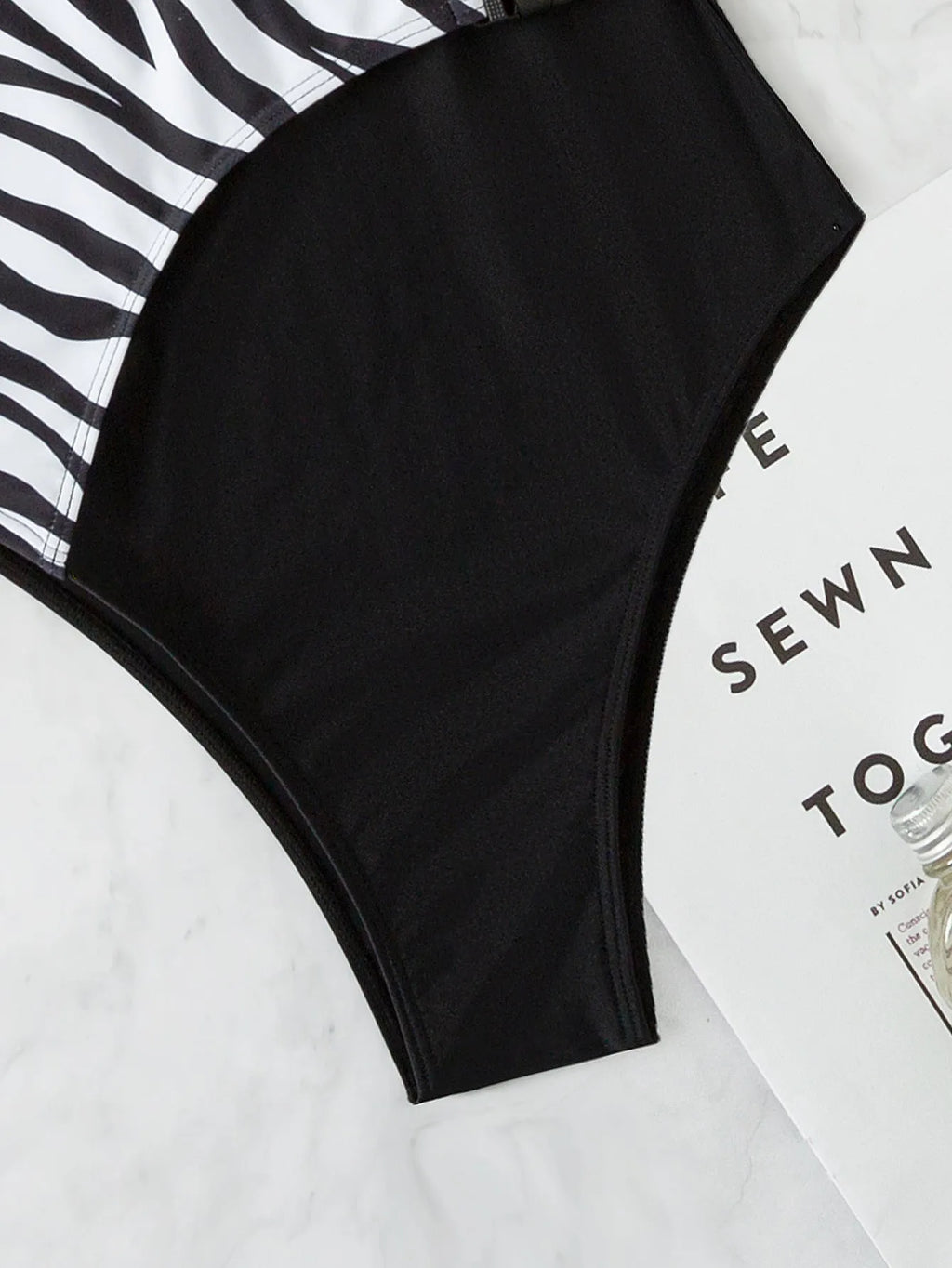 Women's one-piece swimsuit, single shoulder, zebra and plain black polyester patchwork, sleeveless
