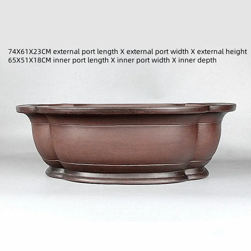 Handmade antique purple clay flowerpot in a crabapple shape, 74cm long.