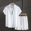 Men's black cotton blend short sleeve shirt and shorts casual suit set on a white background.