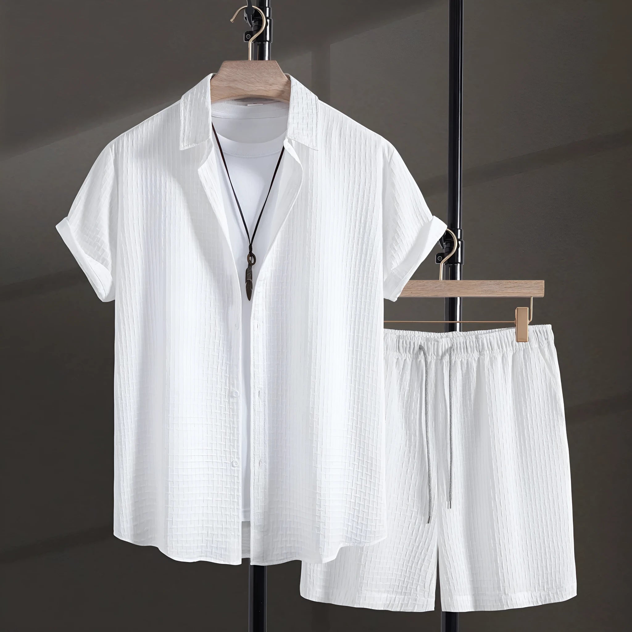 Men's black cotton blend short sleeve shirt and shorts casual suit set on a white background.