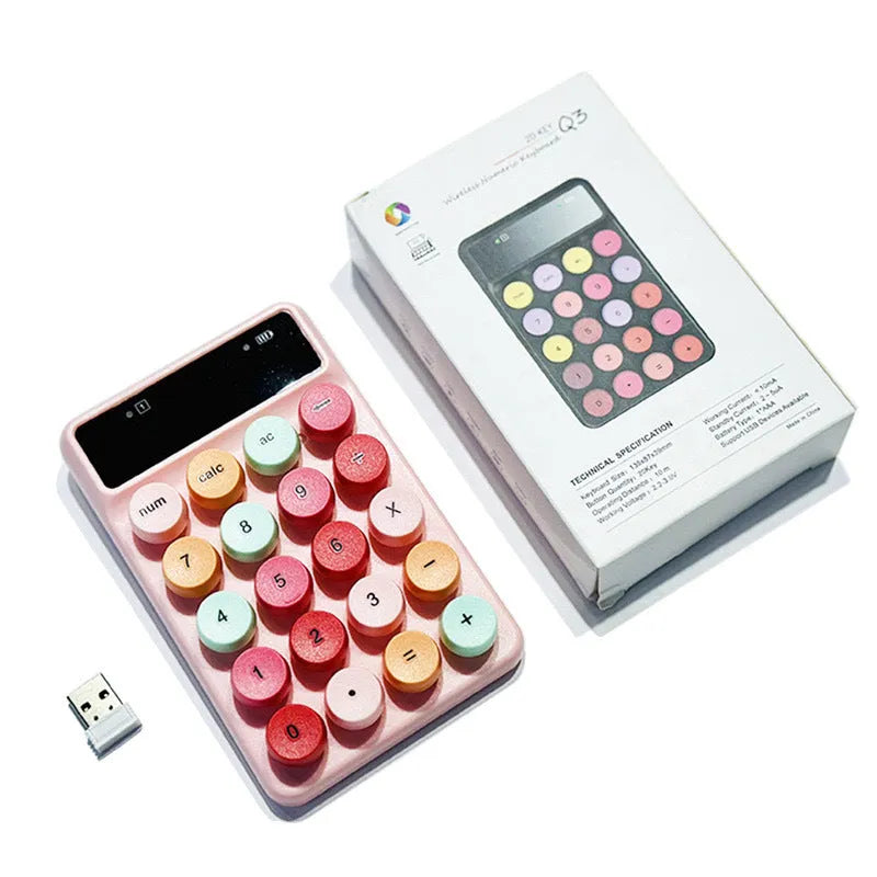 Mini portable wireless keyboard in a macaron colour option on a desk.