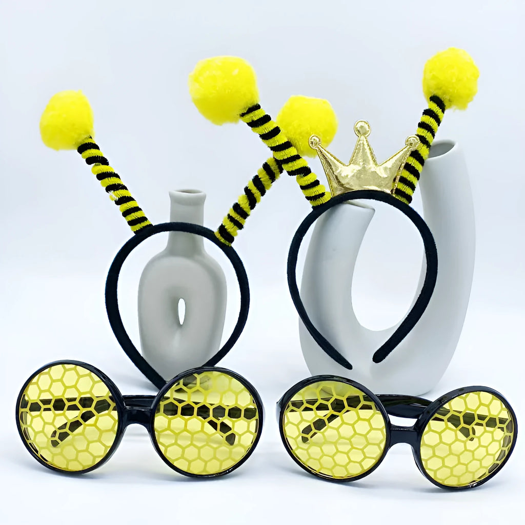 Yellow bee-themed party costume headband and glasses set on cloth material