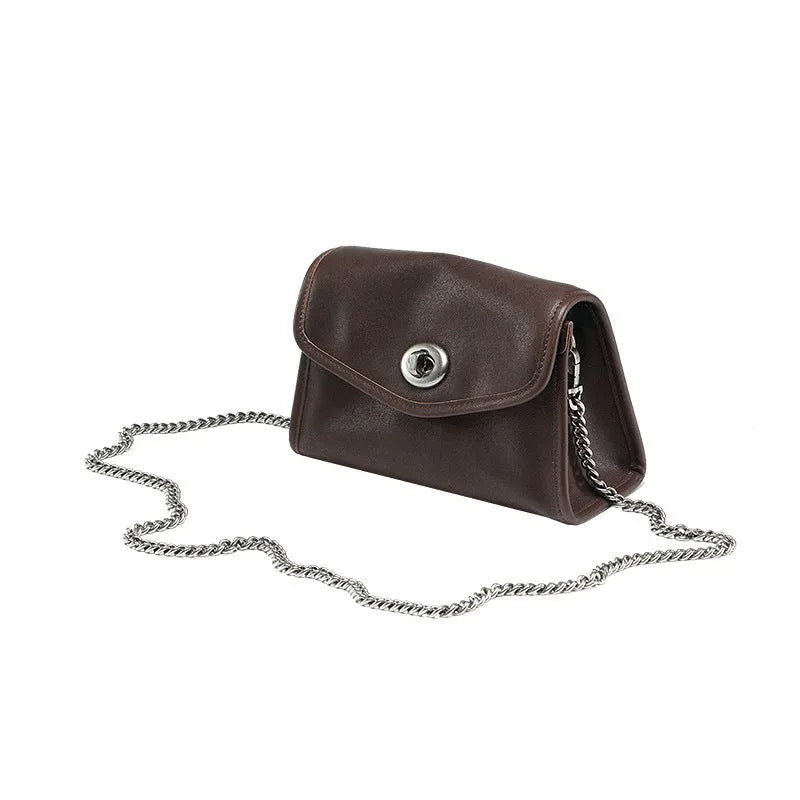 Small genuine leather messenger bag in Black with envelope flap and single shoulder strap