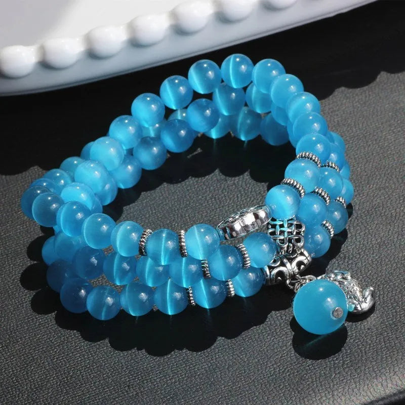 Three-ring opal bracelet with cat eye design and lucky cat elements in geometric shape