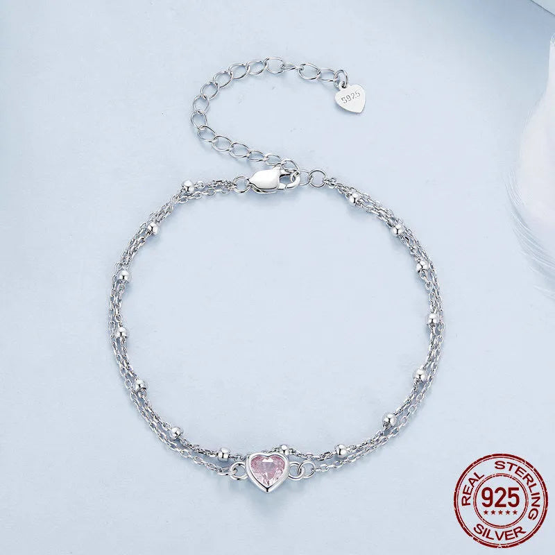 Sweet style sterling silver bracelet with small heart pendant on an adjustable chain.