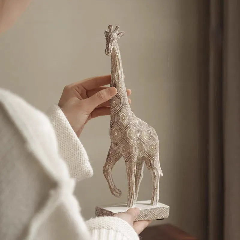 Wood colour synthetic resin giraffe ornament sculpture measuring 30.5cm tall on display.