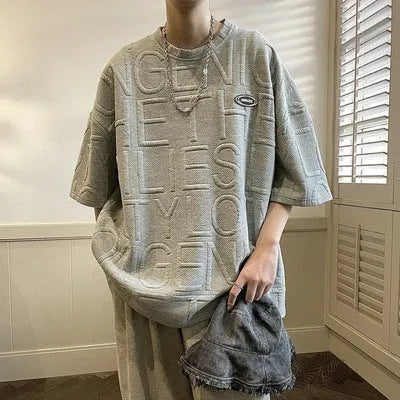 Men's grey t-shirt with raised black letter print, short sleeves, loose fit