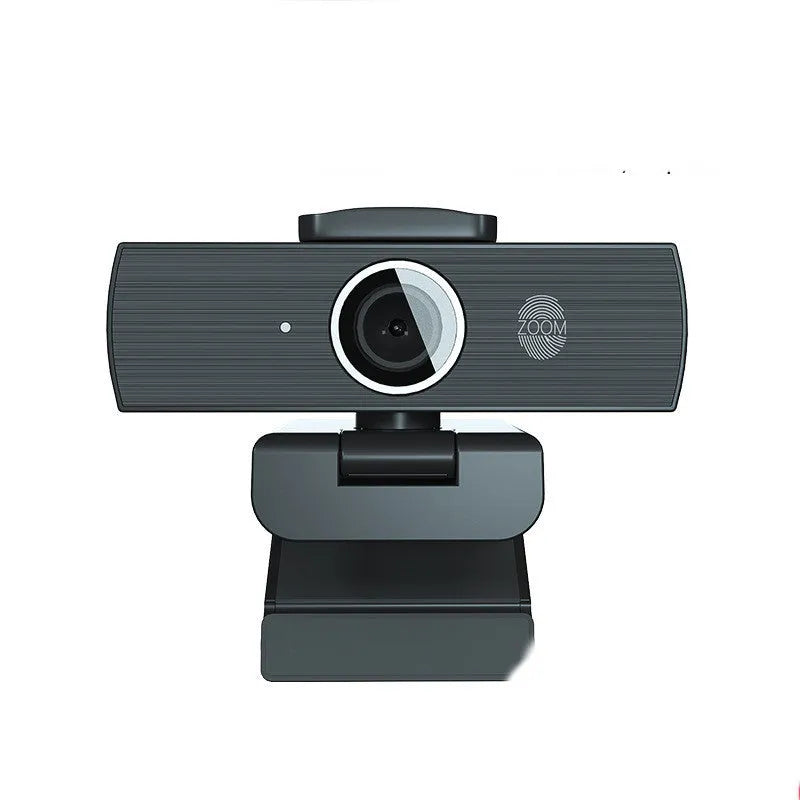 Black USB computer webcam with magnetic privacy cover shown detached