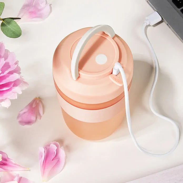 Grape purple portable USB blender cup with lid, showing stainless steel blades inside 400ml capacity bottle.