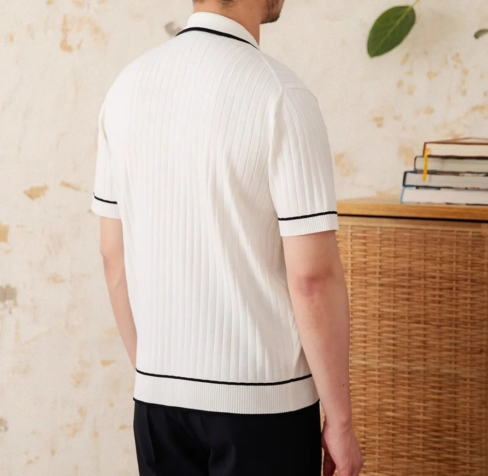 Slim-fit black knitting polo shirt with a lapel collar and short sleeves on a neutral background.