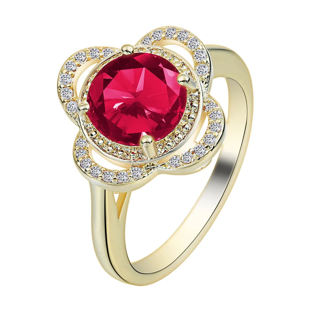 Copper fruit-shaped ring with a central zircon inlay on a model's finger.