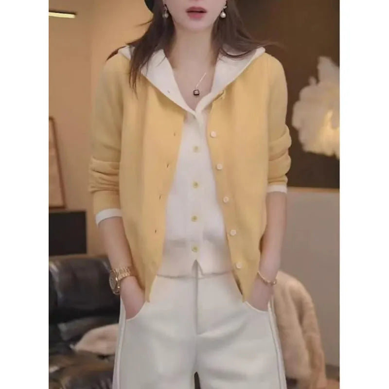 Women's long sleeve knit cardigan in pink with false two-piece design and colour contrast