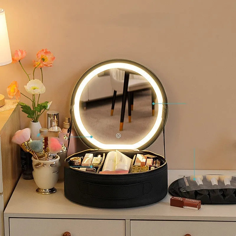Round black PU leather makeup bag with open lid showing internal LED mirror and cosmetic partitions.
