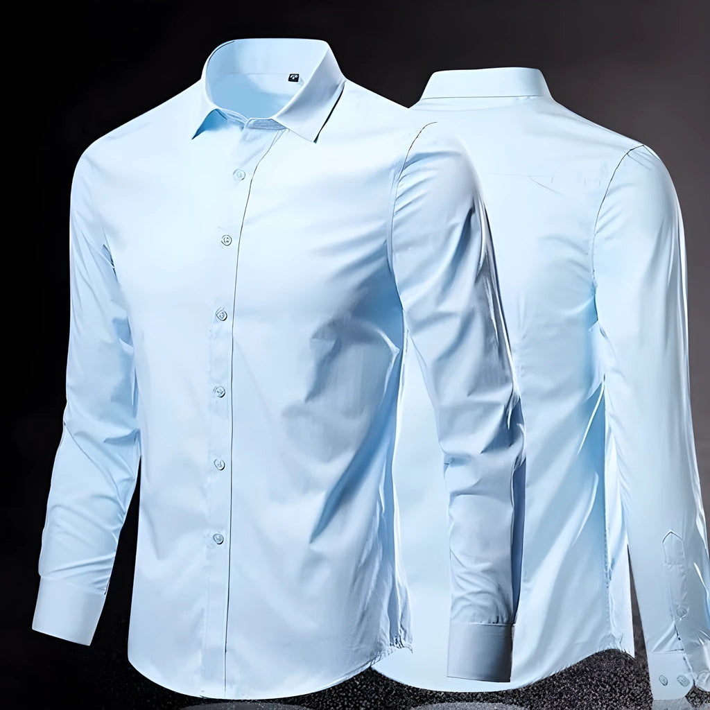Man wearing a loose-fit long-sleeve linen shirt in a neutral colour.