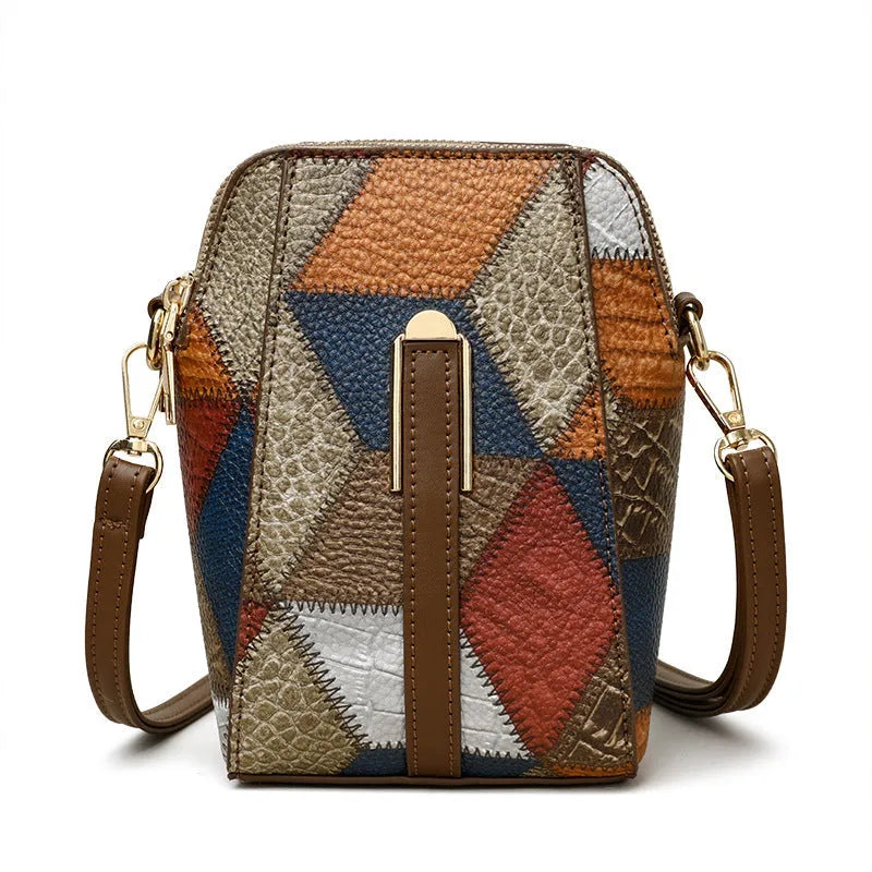 Soft PU shoulder bag with stitching detail, single strap, sandwich pocket, in irregular blue and black or blue and brown.