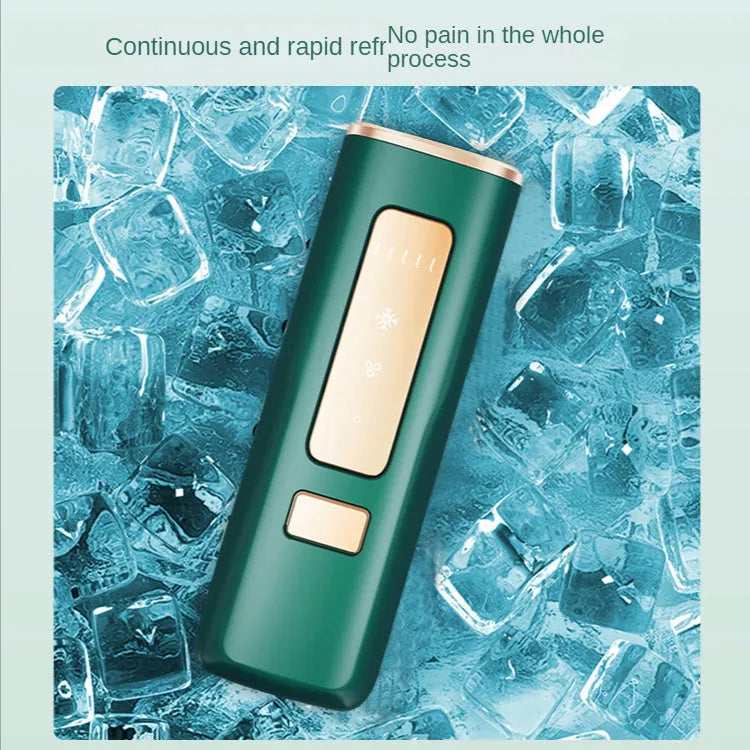 Laser hair remover permanent freezing point sapphire home use device in dark green or green, 150x67x36mm, with sunglasses and shaving knife.
