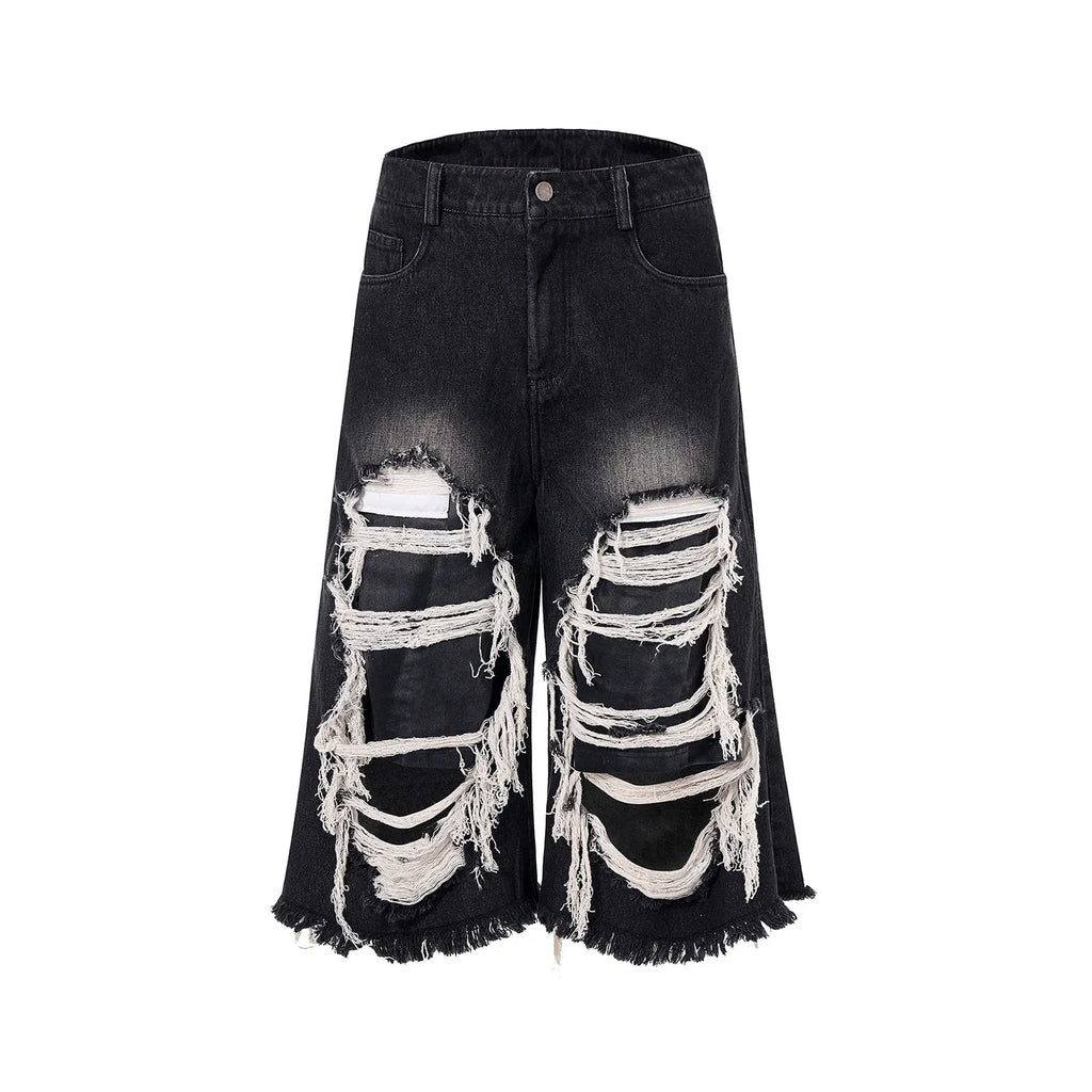 Black women's cropped wide-leg jeans with ripped patch detail on mid-high waist.
