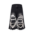 Black women's cropped wide-leg jeans with ripped patch detail on mid-high waist.