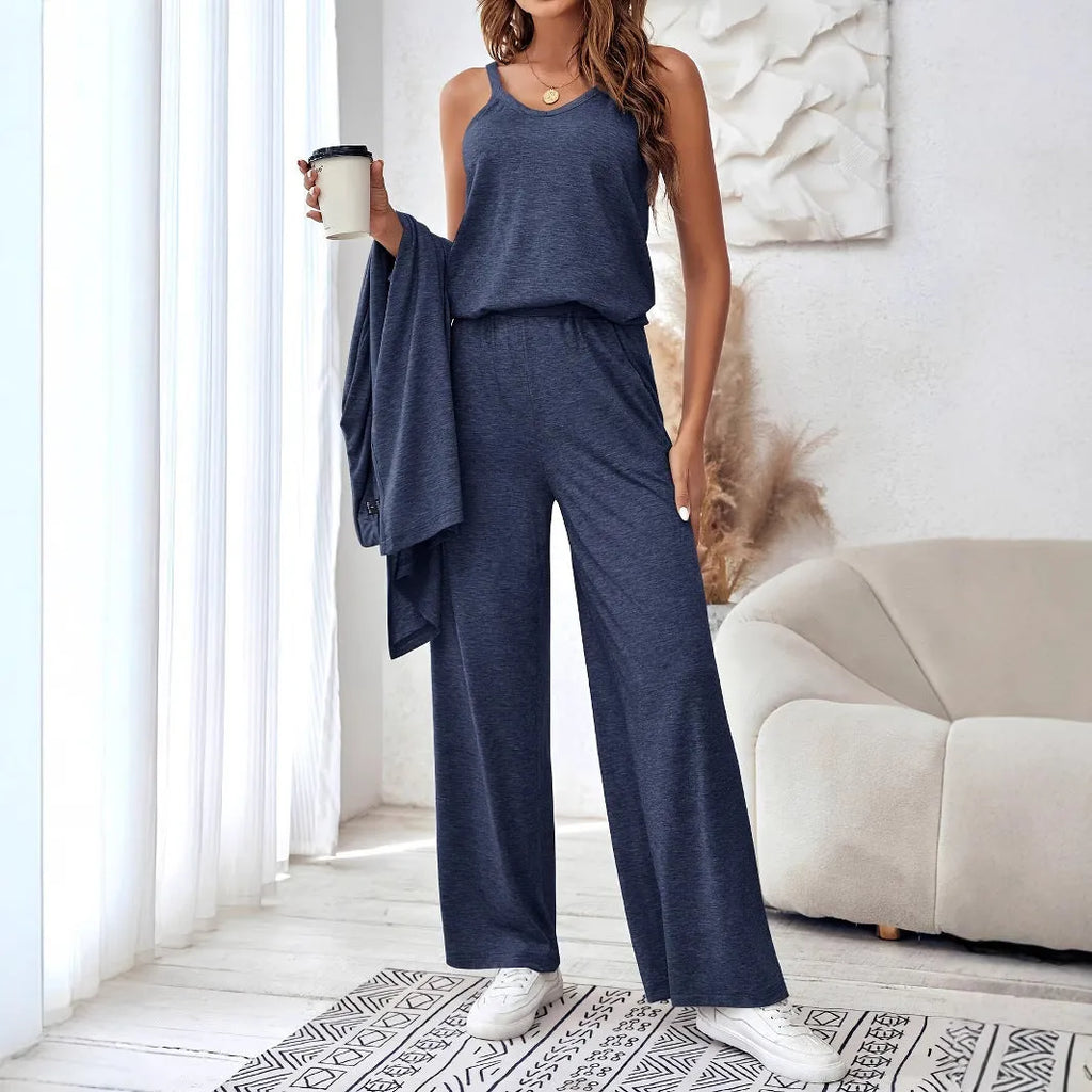 Blue women's three-piece suit set with top, trousers, and suspenders on a hanger