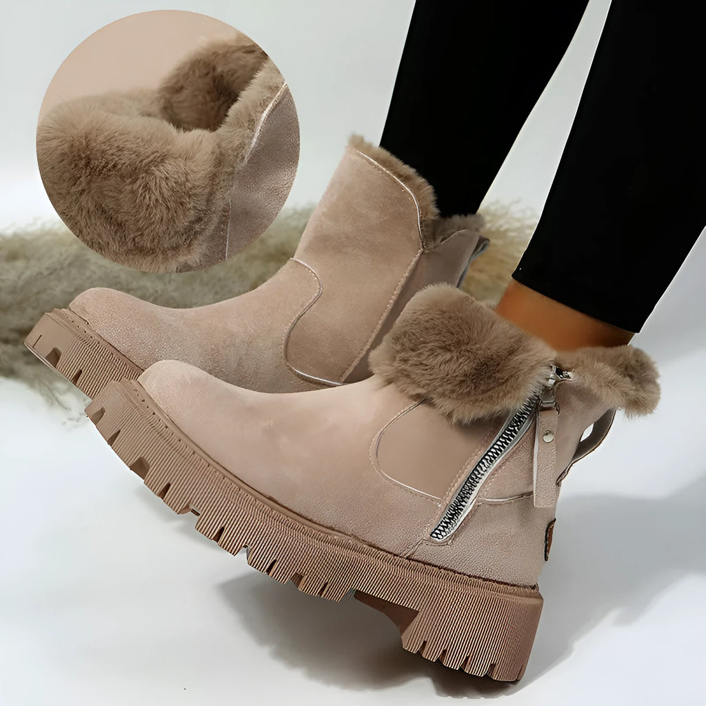 Women's black high-top snow boots with a side zipper and round toe on a non-slip rubber sole.