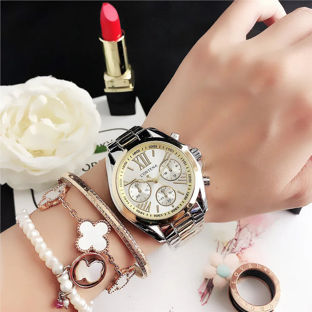 Women's silver rose gold diamond quartz watch with mesh strap, 15mm thick case.