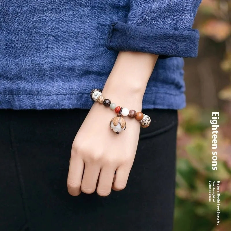 Handcrafted 18-seed Bodhi bead bracelet with geometric design on 16cm wrist