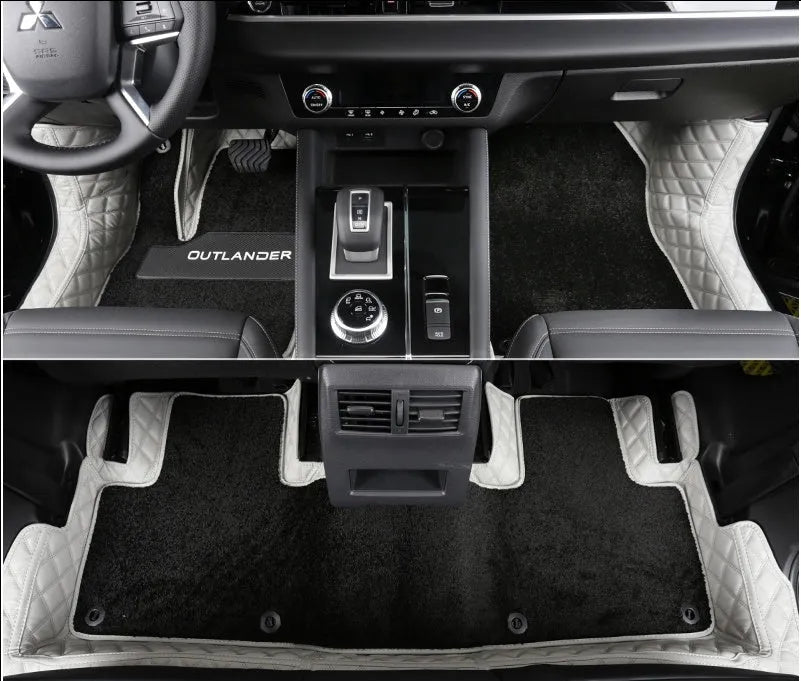 Mitsubishi Outlander full surround floor mats in black, fitted in a car footwell.