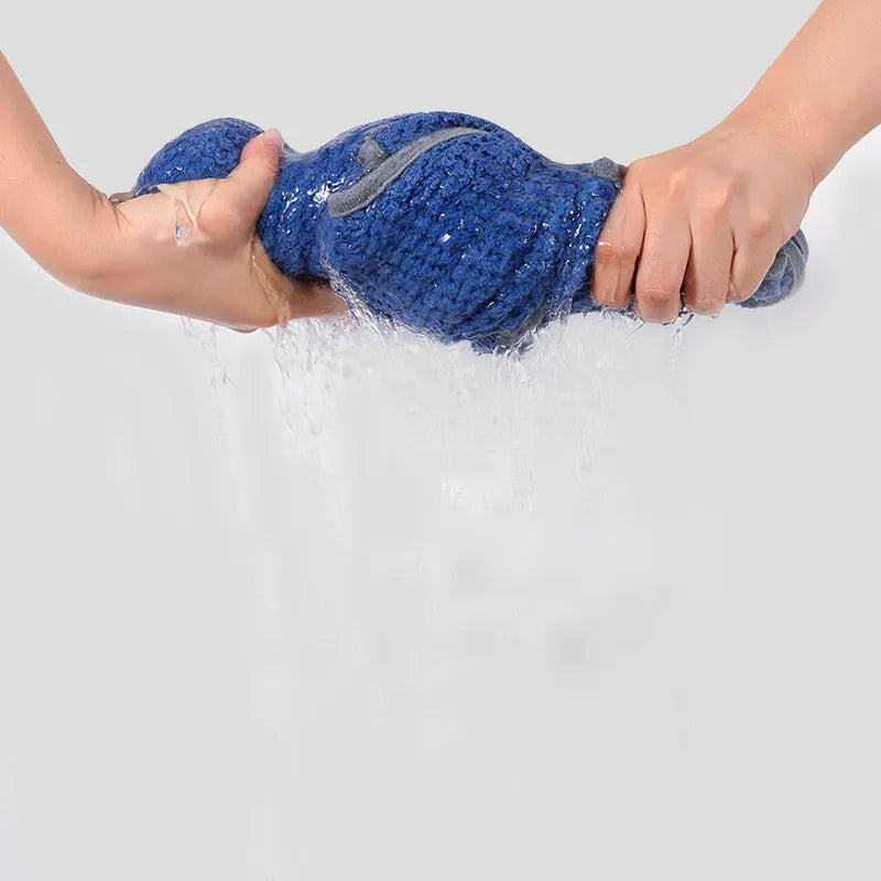Blue adjustable dog bath robe towel wrapped around a dog, showing the waistband fastener and absorbent fabric.