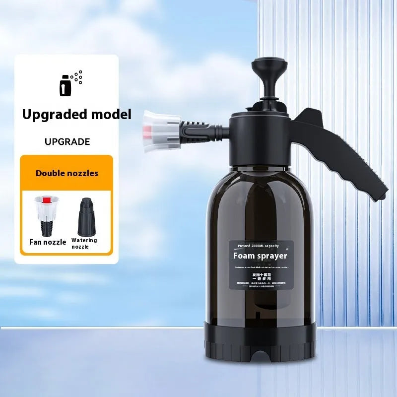 Black handheld 2L foam watering can sprayer with pump handle and two nozzles.