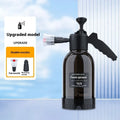 Black handheld 2L foam watering can sprayer with pump handle and two nozzles.