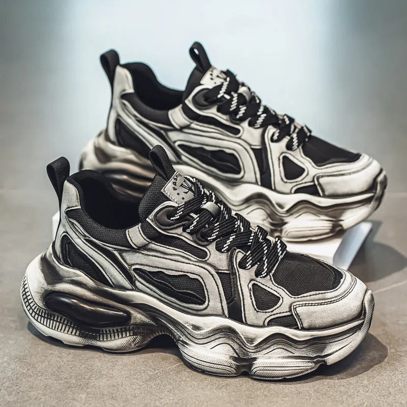 Men's black mesh sneakers with a lace-up front, platform sole, and cross strap detail on a white background