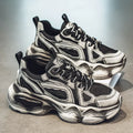 Men's black mesh sneakers with a lace-up front, platform sole, and cross strap detail on a white background