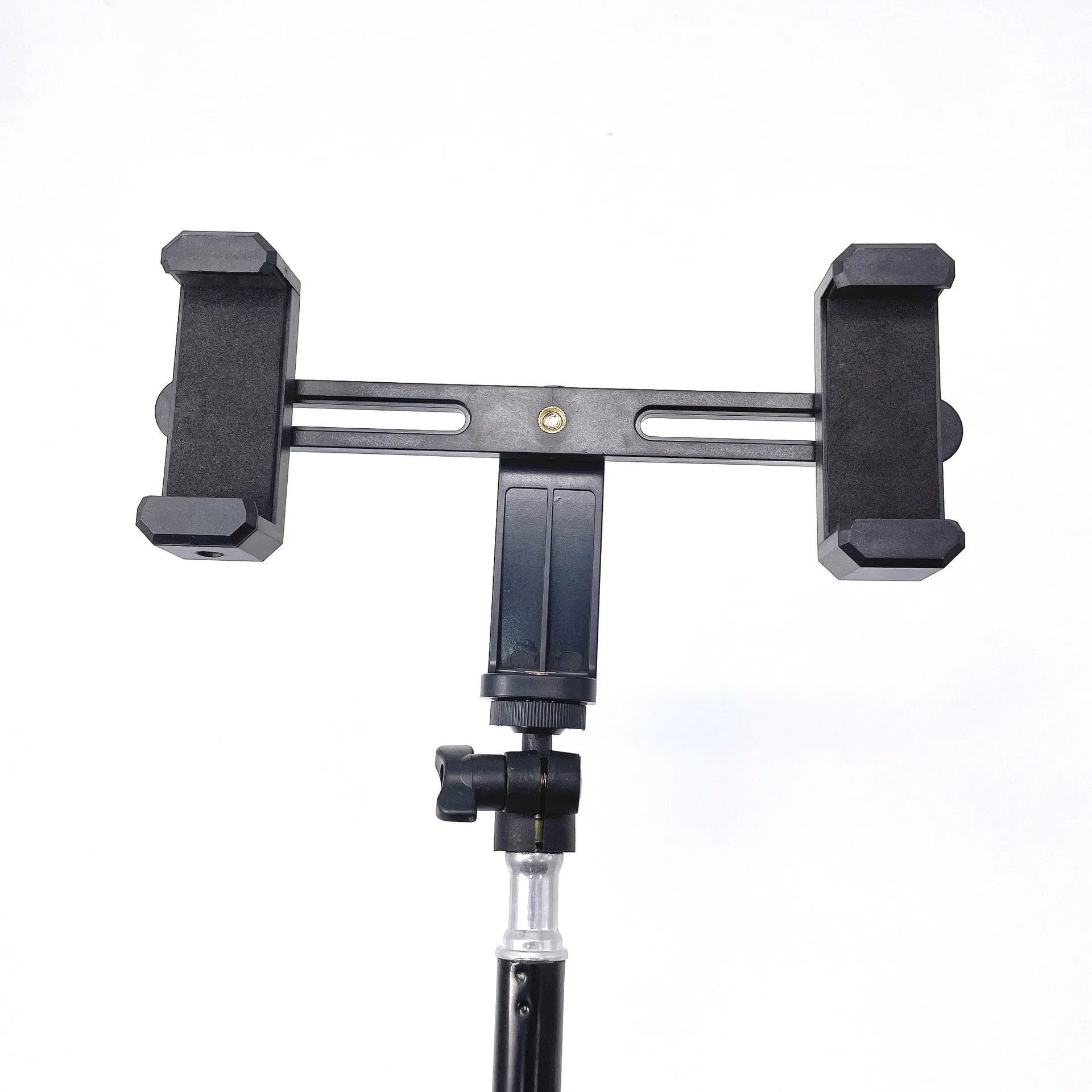 Black mobile phone tripod extended to 1.1m on a desk showing metal legs and phone mount
