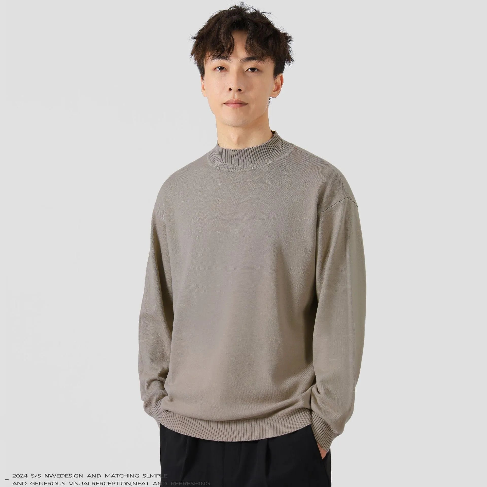 Men's loose fit long sleeve casual jumper in army green colour on a hanger.