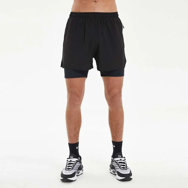 Men's black double-layer running shorts with inner liner on a man running outdoors.