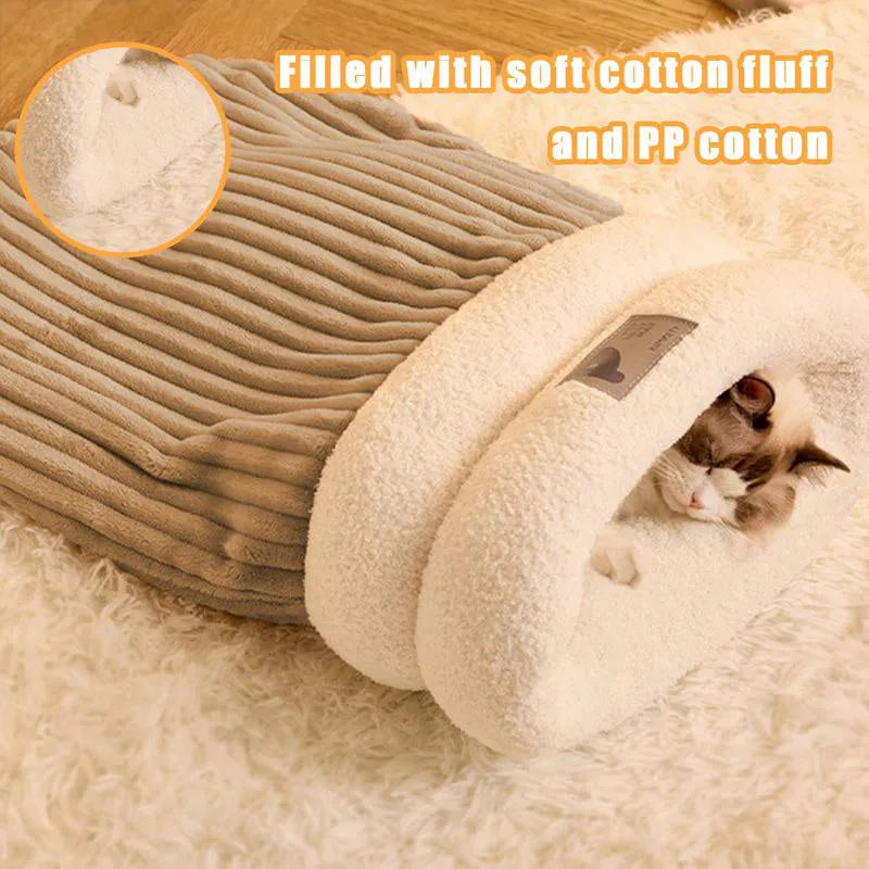 Brown plush semi-enclosed cat sleeping bag with thick stripes, shown on a floor.