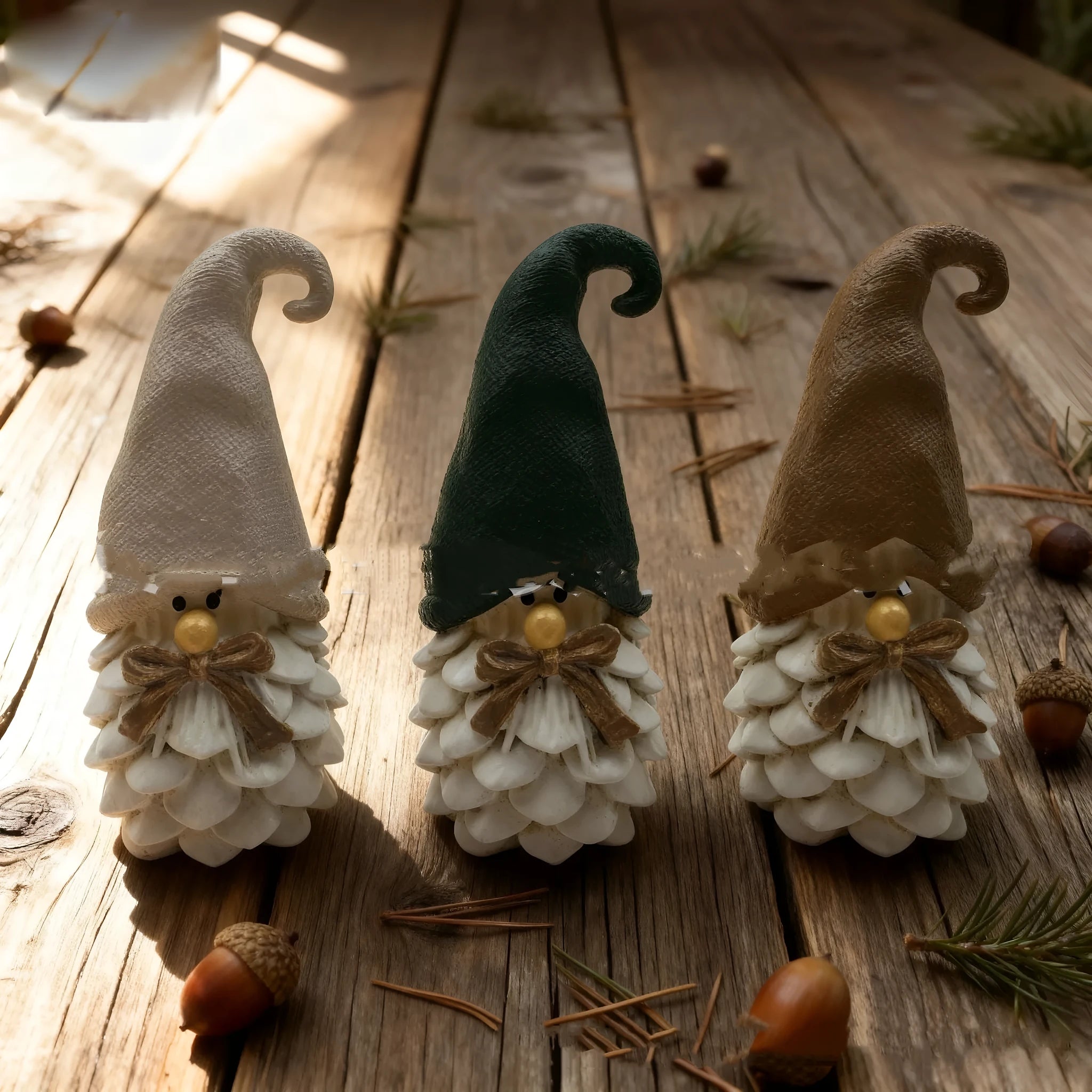 Set of three brown resin dwarf pine cone decorations on display